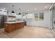 Modern kitchen featuring stainless steel appliances, a large island, and ample counter space at 6630 Vesuvius Furnace Rd # 1, Denver, NC 28037