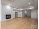 Spacious living room boasting a fireplace, recessed lighting, and hardwood floors at 6630 Vesuvius Furnace Rd # 1, Denver, NC 28037