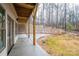 Patio featuring concrete flooring, a brick retaining wall, and a stained wood beam ceiling at 6630 Vesuvius Furnace Rd # 1, Denver, NC 28037