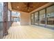 Outdoor back porch featuring wood flooring, a wood ceiling, and a wooded view at 6630 Vesuvius Furnace Rd # 1, Denver, NC 28037