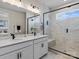 Elegant bathroom with double vanity, walk-in shower, and modern fixtures at 118 Berkeley Ave # D, Mooresville, NC 28117