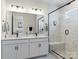 Double vanity bathroom with a large shower and modern finishes at 118 Berkeley Ave # D, Mooresville, NC 28117