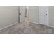 Spacious bedroom with carpet flooring and access to bathroom at 118 Berkeley Ave # D, Mooresville, NC 28117