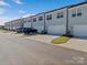 Row of townhouses with attached garages and parking at 118 Berkeley Ave # D, Mooresville, NC 28117