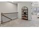 Upstairs hallway features neutral carpet, an open railing, and a bookshelf at 118 Berkeley Ave # D, Mooresville, NC 28117