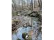 Serene creek running through the property's wooded area at 1386 Old Pinckney Rd, York, SC 29745