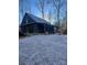 Dark wood cabin with metal roof and porch at 1386 Old Pinckney Rd, York, SC 29745