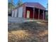 Spacious red metal garage with three roll-up doors at 1386 Old Pinckney Rd, York, SC 29745