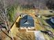 Aerial view showcasing the home, complete with a large, fenced-in yard and outbuilding at 119 E Ohio Ave, Bessemer City, NC 28016