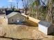 This aerial view highlights the spacious backyard, complete with a shed and new wooden privacy fence at 119 E Ohio Ave, Bessemer City, NC 28016
