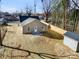This aerial view shows the backyard with a newly installed fence and patio at 119 E Ohio Ave, Bessemer City, NC 28016