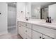 Bathroom featuring double vanity, sleek hardware, and a well-lit mirror at 119 E Ohio Ave, Bessemer City, NC 28016