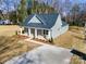 Charming single-story home with a covered porch, vinyl siding, and manicured landscaping at 119 E Ohio Ave, Bessemer City, NC 28016