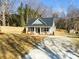 Beautiful home showcasing a manicured front yard and a freshly paved driveway at 119 E Ohio Ave, Bessemer City, NC 28016