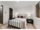 Cozy bedroom with black metal bed frame and neutral decor at 158 Mattoon St, Charlotte, NC 28216