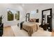 Main bedroom with large windows and a tranquil view at 158 Mattoon St, Charlotte, NC 28216