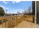 Wooden deck overlooking the neighborhood with wooden railings at 158 Mattoon St, Charlotte, NC 28216