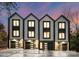 Three modern townhouses with attached garages and stylish exterior at 158 Mattoon St, Charlotte, NC 28216