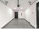 Attached garage with extra storage space and epoxy flooring at 158 Mattoon St, Charlotte, NC 28216