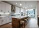 Modern kitchen with island, white cabinets, and stainless steel appliances at 158 Mattoon St, Charlotte, NC 28216