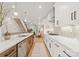 Modern kitchen with island, white cabinets, and stainless steel appliances at 158 Mattoon St, Charlotte, NC 28216