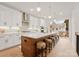 Modern kitchen with island, white cabinets, and stainless steel appliances at 158 Mattoon St, Charlotte, NC 28216