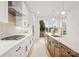 Modern kitchen with island, white cabinets, and stainless steel appliances at 158 Mattoon St, Charlotte, NC 28216