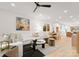 Open living room with white sectional sofa, and a view into the kitchen at 158 Mattoon St, Charlotte, NC 28216