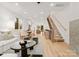 Open concept living room with modern staircase and kitchen views at 158 Mattoon St, Charlotte, NC 28216