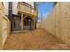 Fenced backyard with elevated deck and patio at 162 Mattoon St, Charlotte, NC 28216