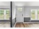 Inviting entry features natural light from many windows and wood-look floors at 3107 Balkan Dr, York, SC 29745