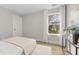 Light-filled bedroom with a large window offering neighborhood views at 5319 Carden Dr, Charlotte, NC 28227