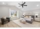 Comfortable bedroom with a large window, a cozy chair, and ample natural light at 5319 Carden Dr, Charlotte, NC 28227