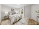 Cozy bedroom with a large area rug, a comfortable bed, and ample natural light at 5319 Carden Dr, Charlotte, NC 28227