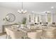 Bright, open-concept dining room with modern chandelier, stylish furnishings, and easy access to living space at 5319 Carden Dr, Charlotte, NC 28227