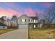 Two-story house with white siding, gray roof, and a two-car garage at 5319 Carden Dr, Charlotte, NC 28227
