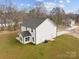 White two-story house with gray roof, and a large backyard at 5319 Carden Dr, Charlotte, NC 28227