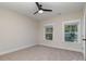 Simple bedroom with carpet flooring and two windows at 605 Julia Ave, Belmont, NC 28012