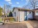 Backyard view featuring a wooden deck, light siding, and a blue door at 105 Victoria Dr, Statesville, NC 28625