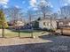 Backyard view with an above-ground pool, partial fence, and additional building at 105 Victoria Dr, Statesville, NC 28625