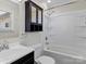 Bright bathroom featuring a shower-tub combo, vanity with sink, and mirrored medicine cabinet at 105 Victoria Dr, Statesville, NC 28625