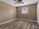 Simple bedroom with wood-look flooring and ceiling fan at 105 Victoria Dr, Statesville, NC 28625