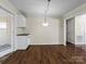 Simple dining area with hardwood floors and view to backyard at 105 Victoria Dr, Statesville, NC 28625