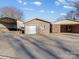 A house with a detached garage and carport next to a concrete driveway under a blue cloudy sky at 105 Victoria Dr, Statesville, NC 28625