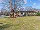 Brick ranch house with landscaped yard at 105 Victoria Dr, Statesville, NC 28625