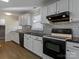 The kitchen features black appliances and a stylish tile backsplash, providing both functionality and aesthetic appeal at 105 Victoria Dr, Statesville, NC 28625