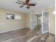 Bright living room featuring laminate wood floors and double french doors at 105 Victoria Dr, Statesville, NC 28625