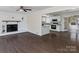 Open-concept living room flowing into kitchen with dark hardwood floors at 105 Victoria Dr, Statesville, NC 28625