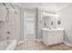 Bathroom with tub/shower combo and single vanity with framed mirror and vanity lighting at 2545 Rea Rd, Charlotte, NC 28226