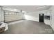 Clean garage with ample space, storage cabinets, and utility sink at 2545 Rea Rd, Charlotte, NC 28226